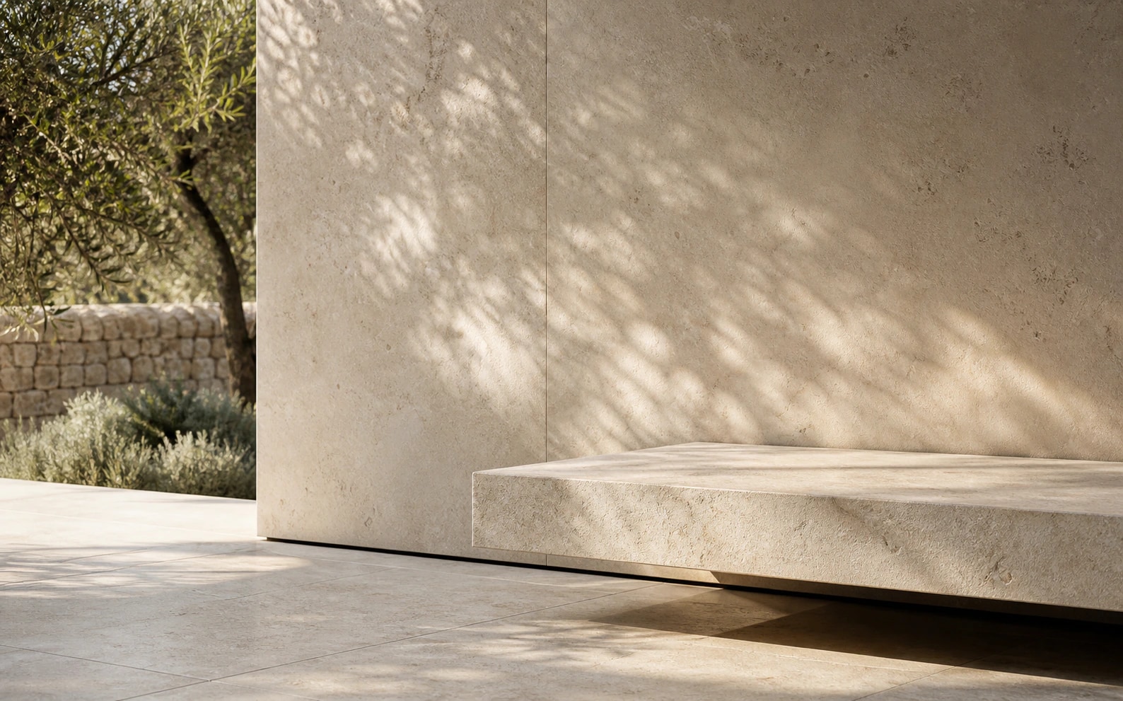 Honed ivory limestone wall and floating bench with natural daylight