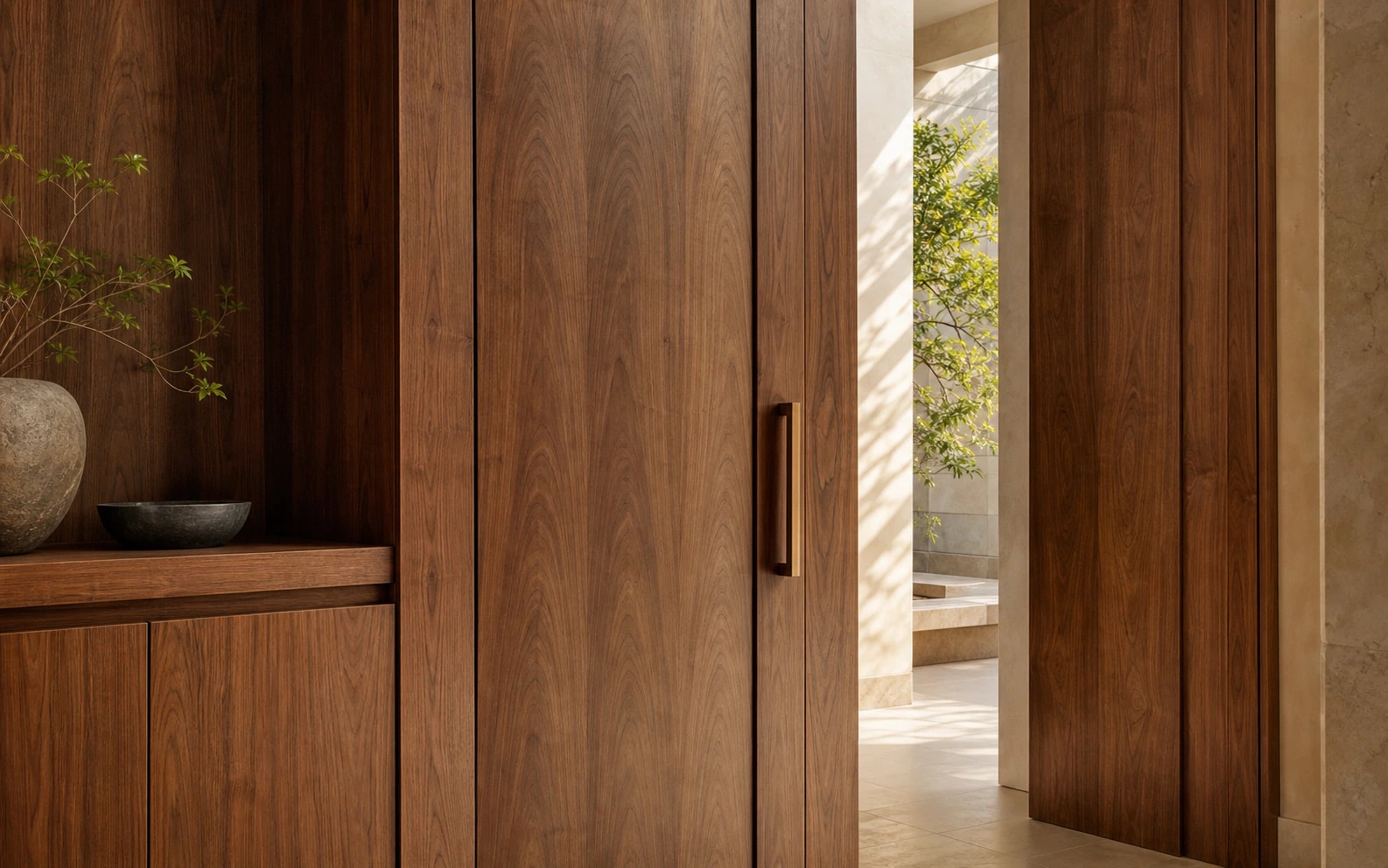 Full-height smoked walnut joinery with continuous grain and shadow gaps